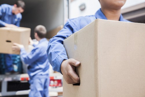 Business moving team handling office furniture in Lewisham