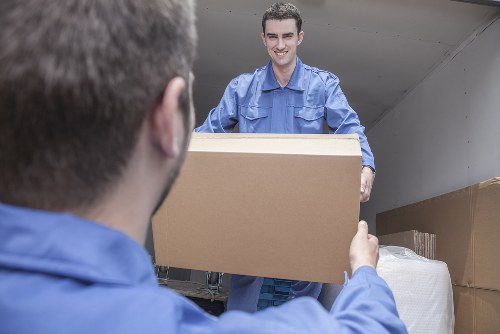Team preparing furniture for transport during a Lewisham house move
