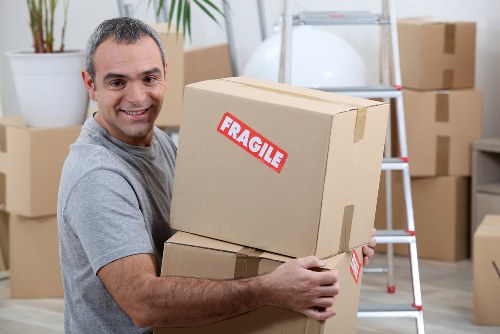 Packed moving boxes and furniture ready for removals in Lewisham