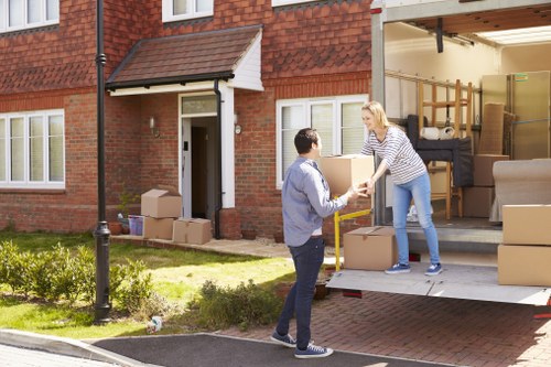 Moving team handling household furniture in Lewisham