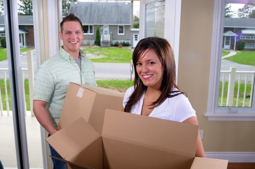Moving van and packed boxes prepared for house removals in Lewisham