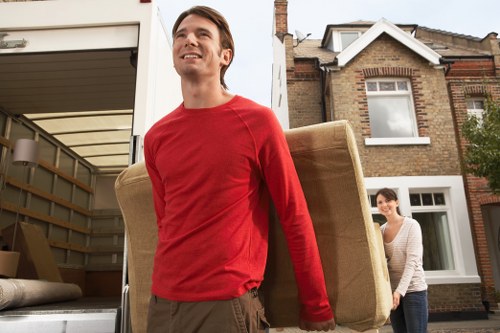 Removal crew loading household items for transport in Lewisham
