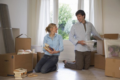 Professional movers loading boxes and furniture carefully