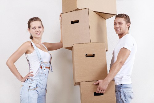 Professional movers carrying furniture during a local move in Lewisham