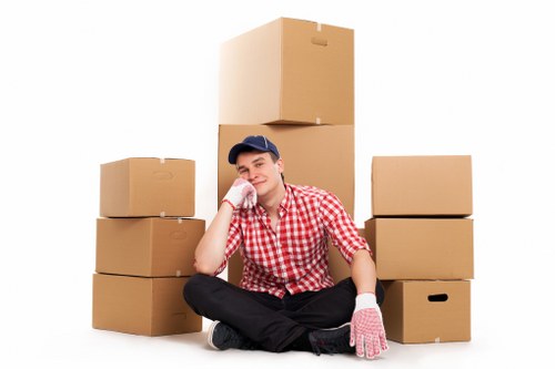 Packed office equipment and labeled boxes ready for removals in Lewisham